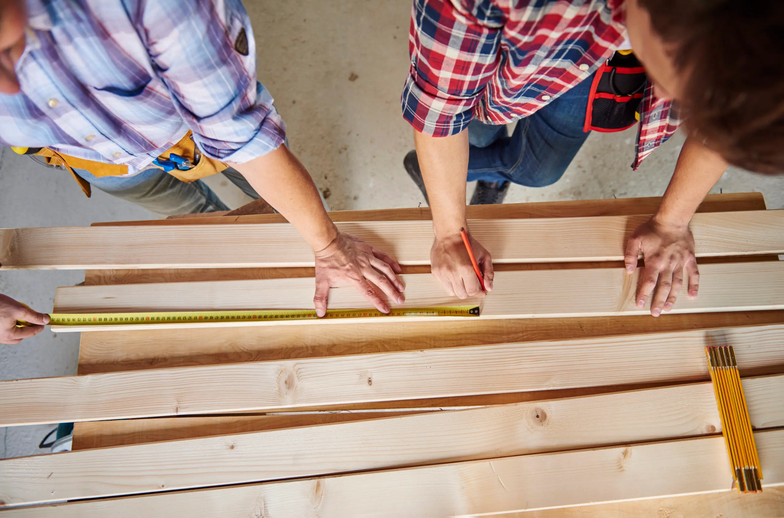 Two deck contractors building a deck