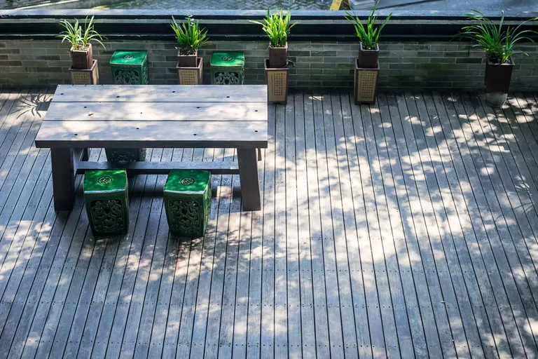 Chairs and a table in a small outside deck