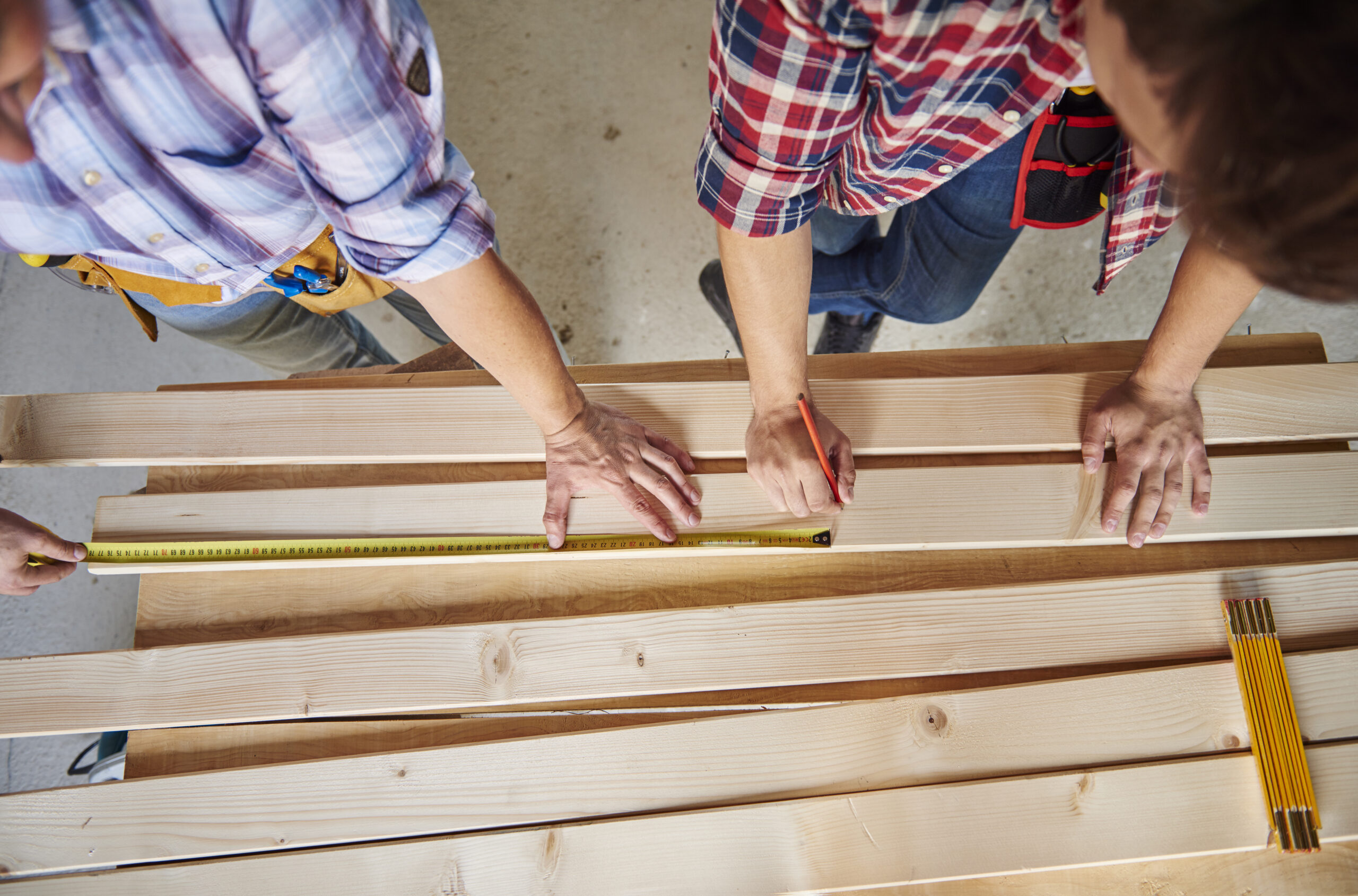 Two deck contractors building a deck